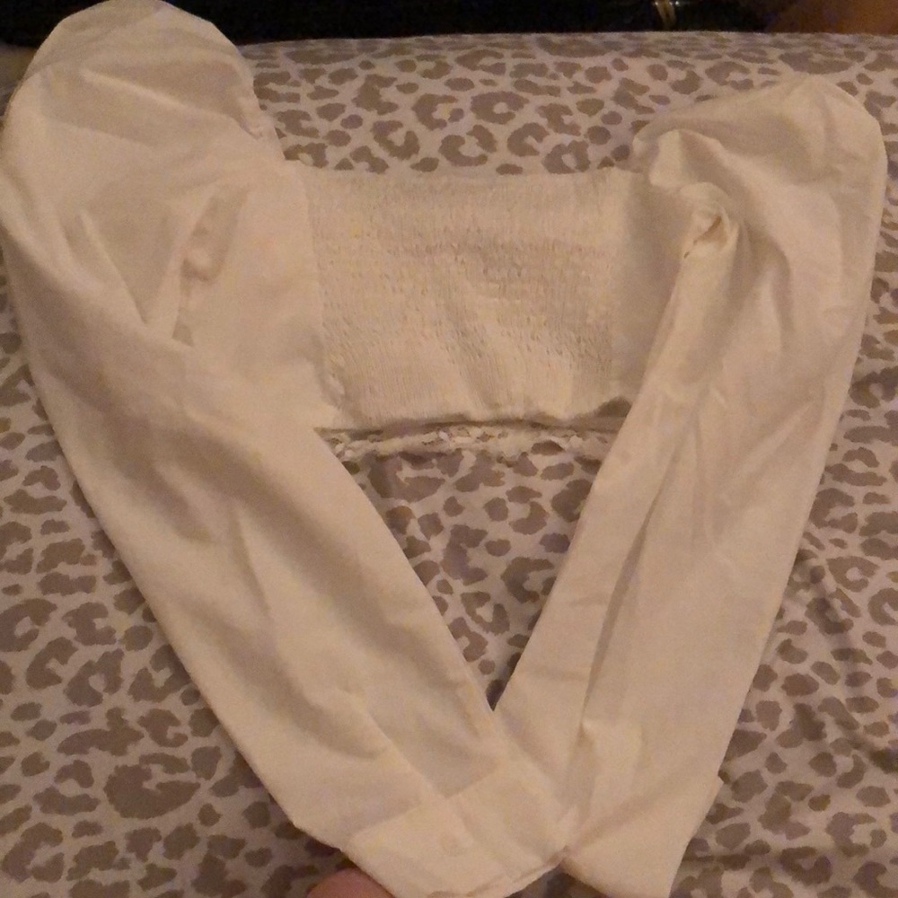 White ruffle long sleeved crop top.